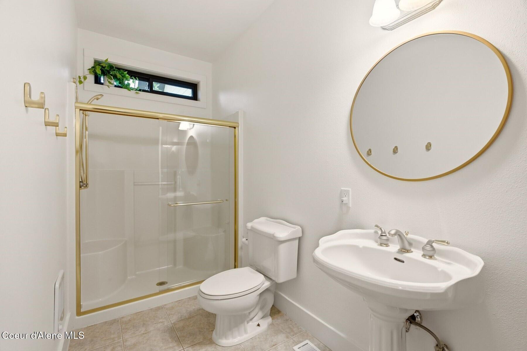 10988 West Thompson Road Coeur D'Alene, ID 83814 - Photo 34 of 71 Main Floor Guest Bathroom