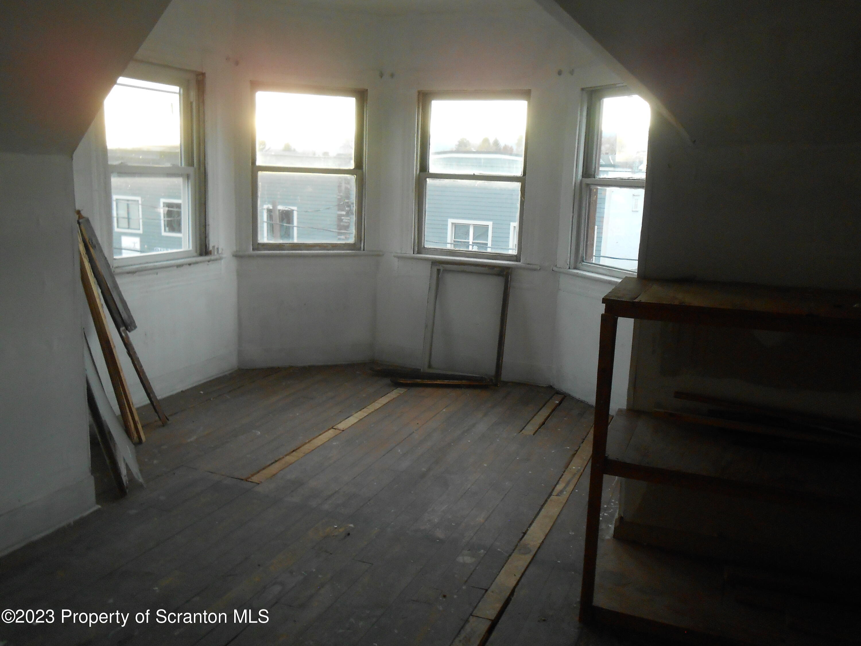 1217 South 1219 Main Avenue Scranton, PA 18504 - Photo 13 of 14 a view of an empty room with a window