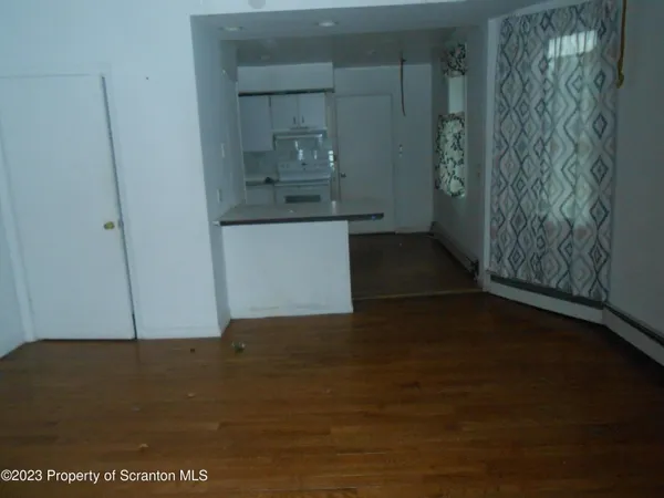 a view of storage and utility room with a fireplace