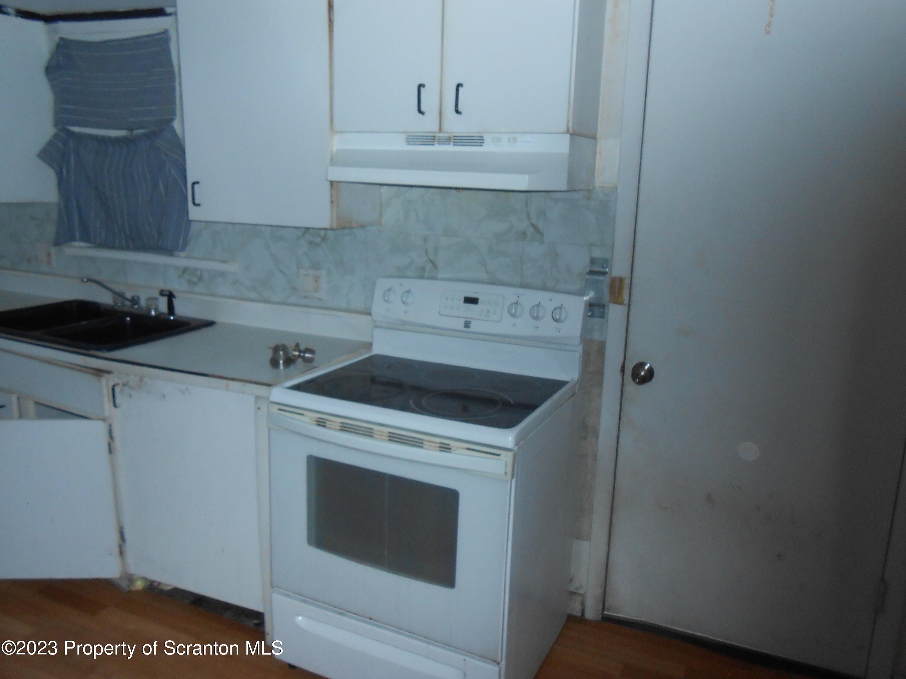 1217 South 1219 Main Avenue Scranton, PA 18504 - Photo 4 of 14 a utility room with sink dryer and washer