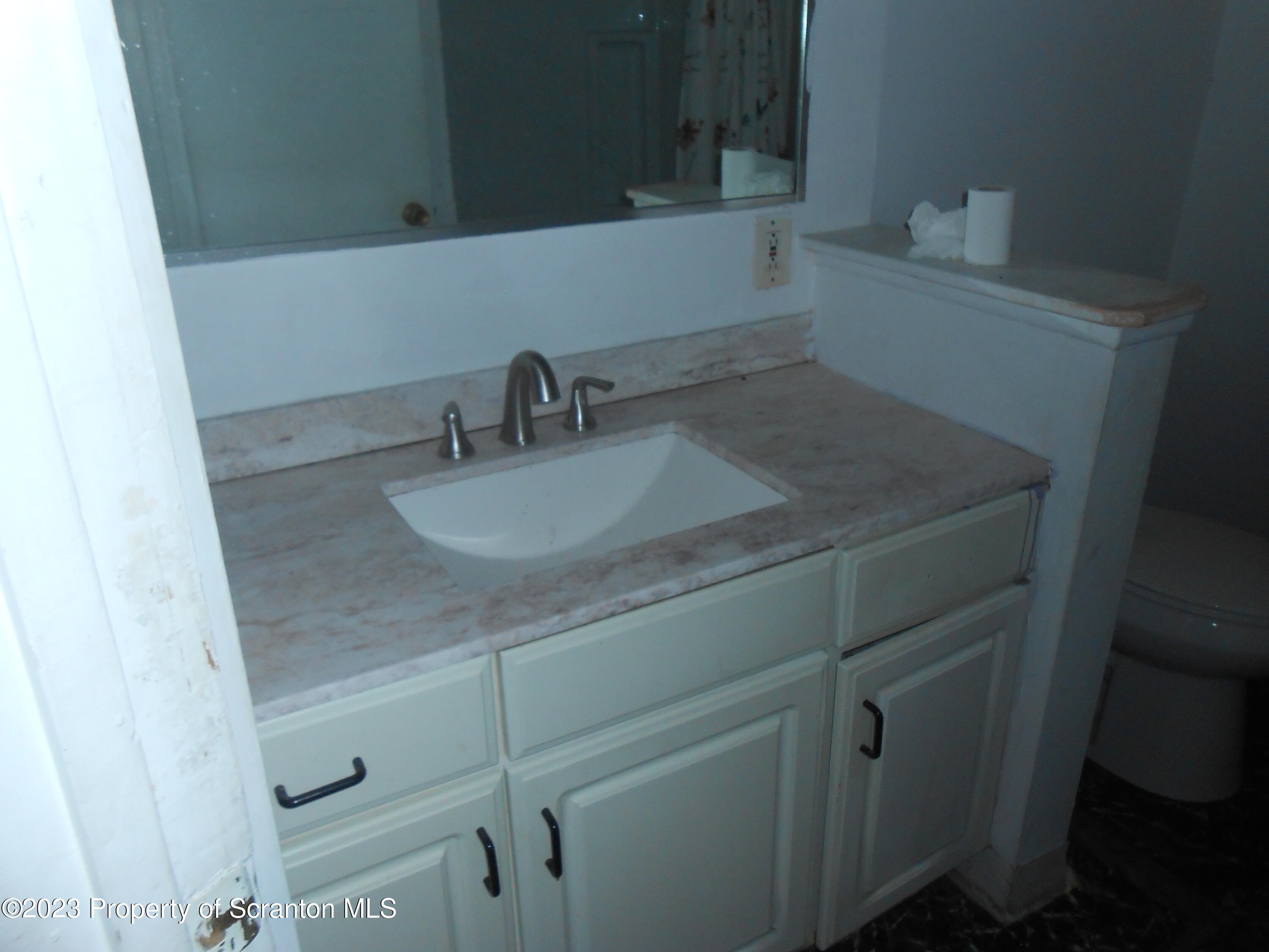 1217 South 1219 Main Avenue Scranton, PA 18504 - Photo 5 of 14 a bathroom with a sink and vanity