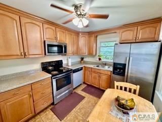 83 Ravine Drive Matawan, NJ 07747 - Photo 11 of 33 a kitchen with a stove a sink and a microwave