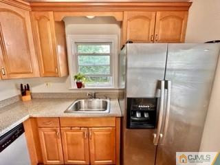 83 Ravine Drive Matawan, NJ 07747 - Photo 13 of 33 a kitchen with a sink a refrigerator and cabinets