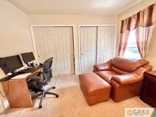 83 Ravine Drive Matawan, NJ 07747 - Photo 19 of 33 a living room with furniture and a window