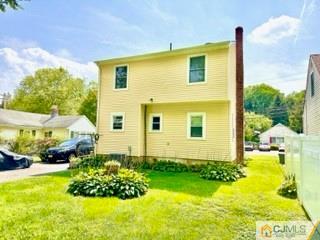 83 Ravine Drive Matawan, NJ 07747 - Photo 2 of 33 a front view of house with yard and trees