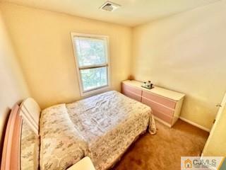 83 Ravine Drive Matawan, NJ 07747 - Photo 24 of 33 a bedroom with a bed and a window