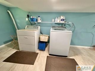 83 Ravine Drive Matawan, NJ 07747 - Photo 30 of 33 a utility room with dryer and washer