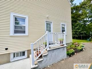 83 Ravine Drive Matawan, NJ 07747 - Photo 31 of 33 a balcony with a table and chairs