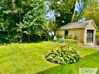 83 Ravine Drive Matawan, NJ 07747 - Photo 6 of 33 a front view of a house with a yard
