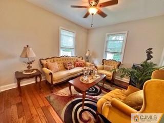 83 Ravine Drive Matawan, NJ 07747 - Photo 8 of 33 a living room with furniture and a chandelier