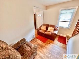 83 Ravine Drive Matawan, NJ 07747 - Photo 10 of 33 a living room with furniture and a window