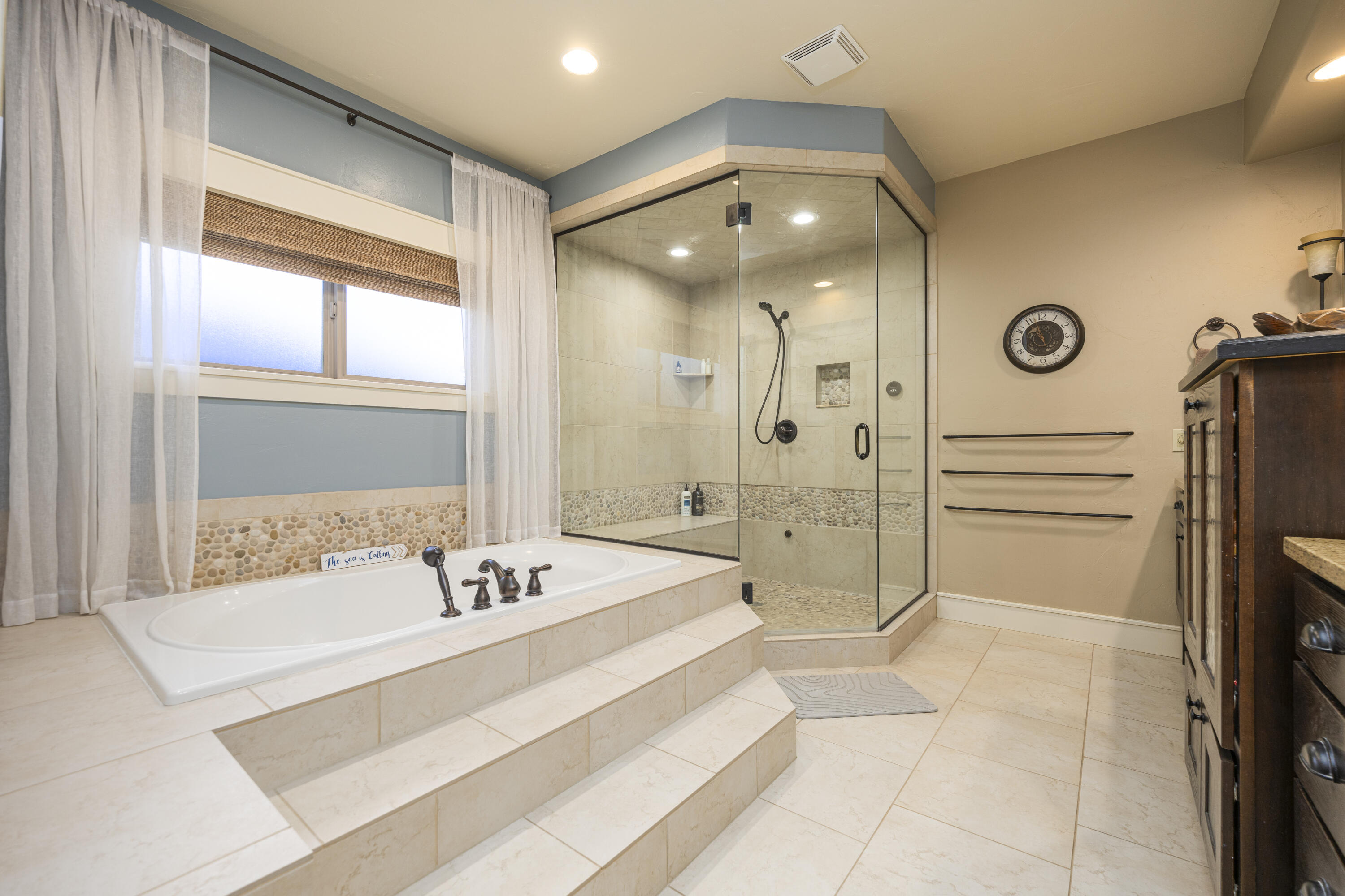 67841 Tumbleweed Road Montrose, CO 81403 - Photo 11 of 21 a spacious bathroom with a double vanity sink a mirror and a shower