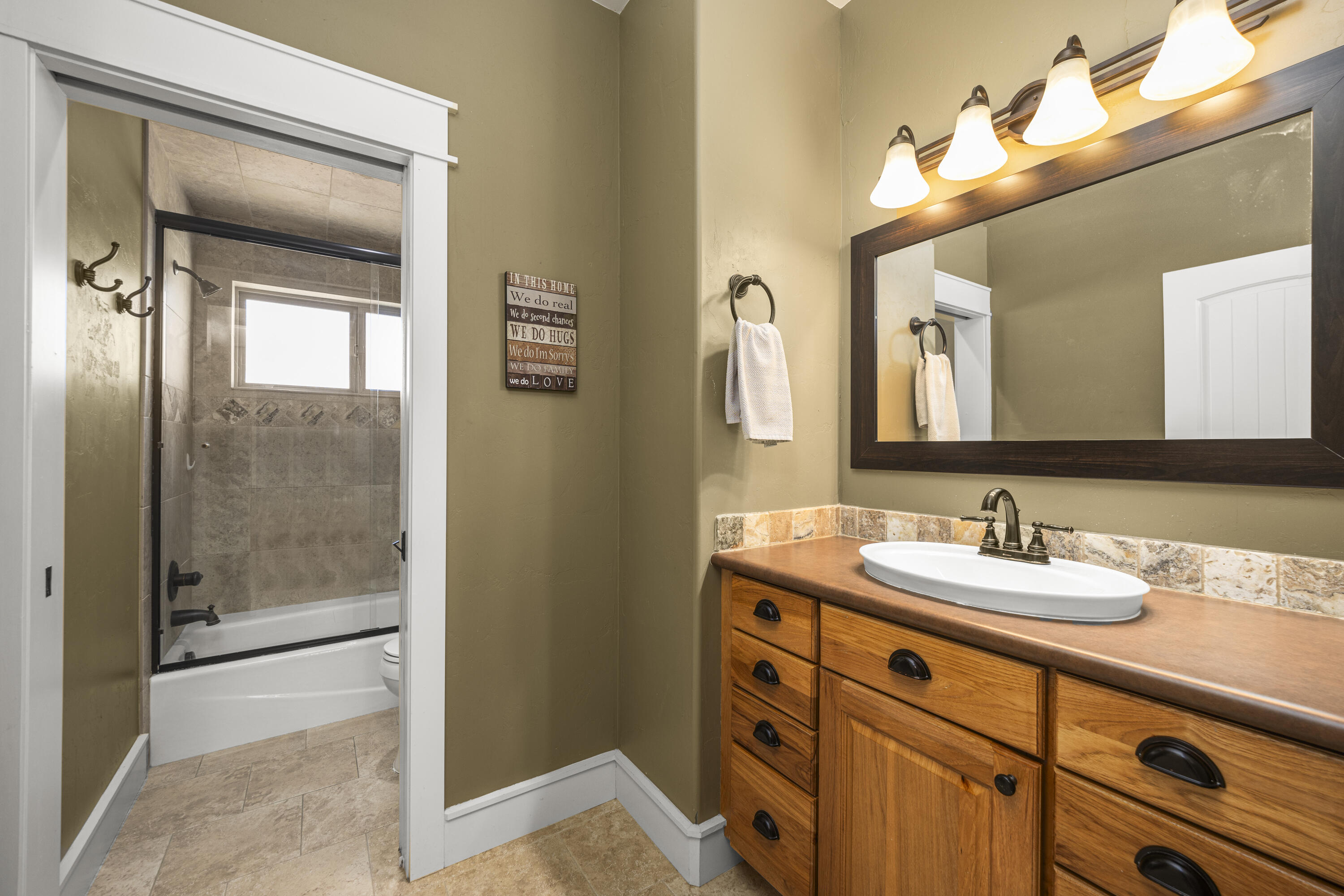 67841 Tumbleweed Road Montrose, CO 81403 - Photo 14 of 21 a bathroom with a sink a vanity and a mirror