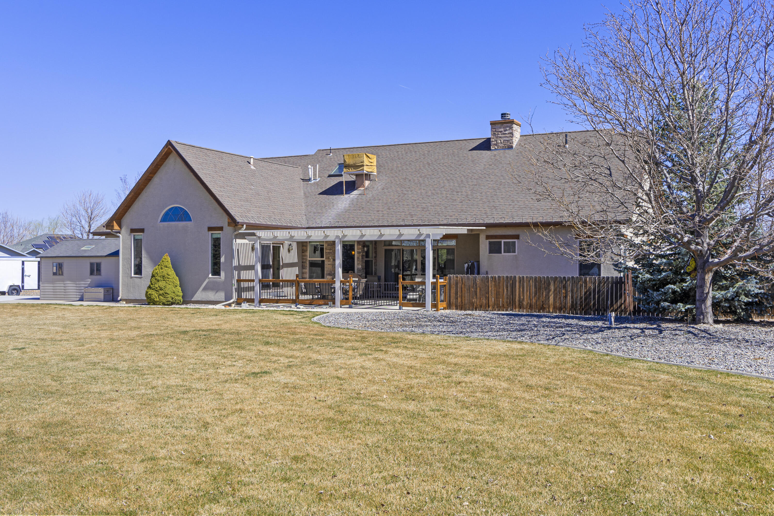 67841 Tumbleweed Road Montrose, CO 81403 - Photo 20 of 21 a front view of a house with a yard and garage