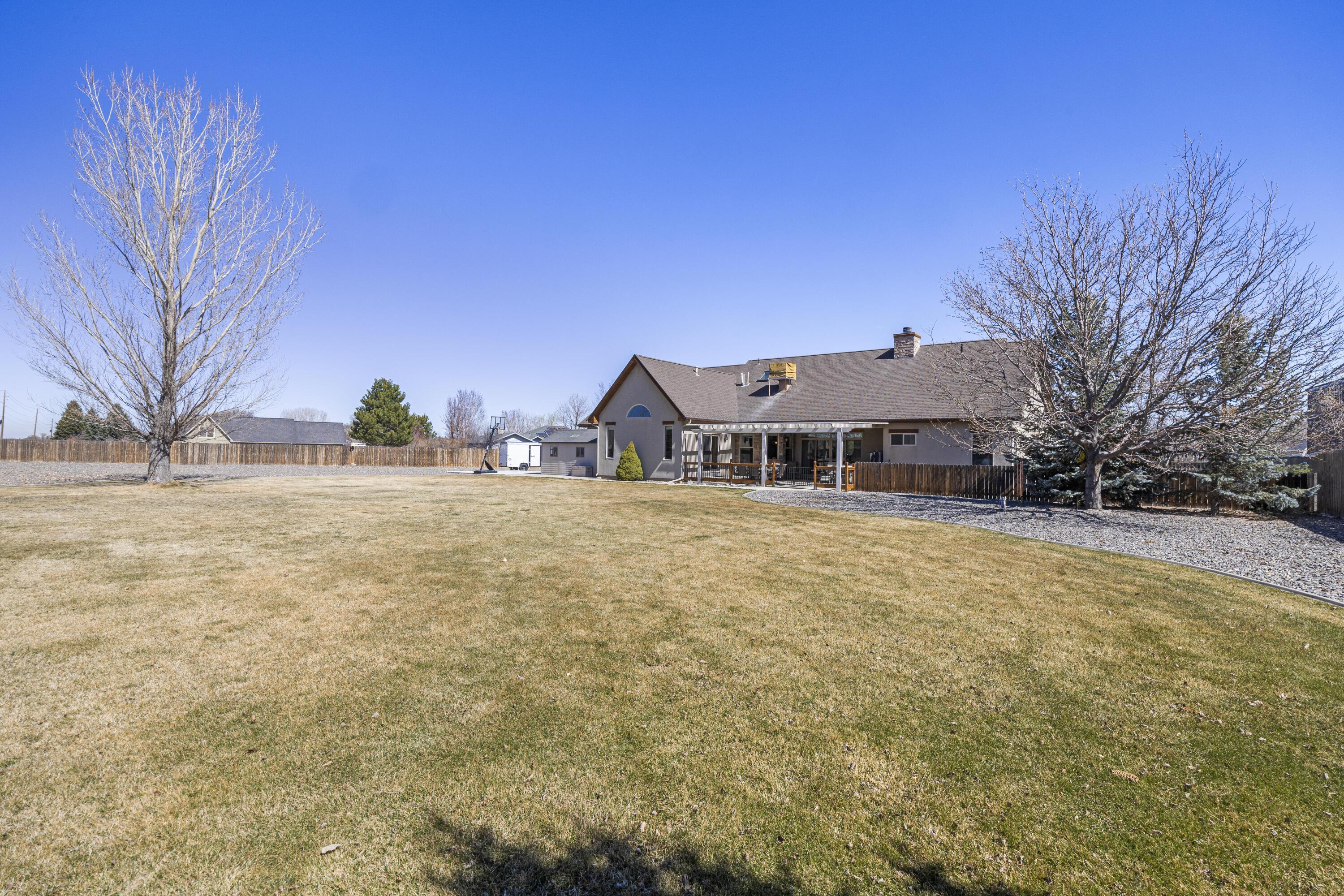67841 Tumbleweed Road Montrose, CO 81403 - Photo 21 of 21 a house with trees in front of it