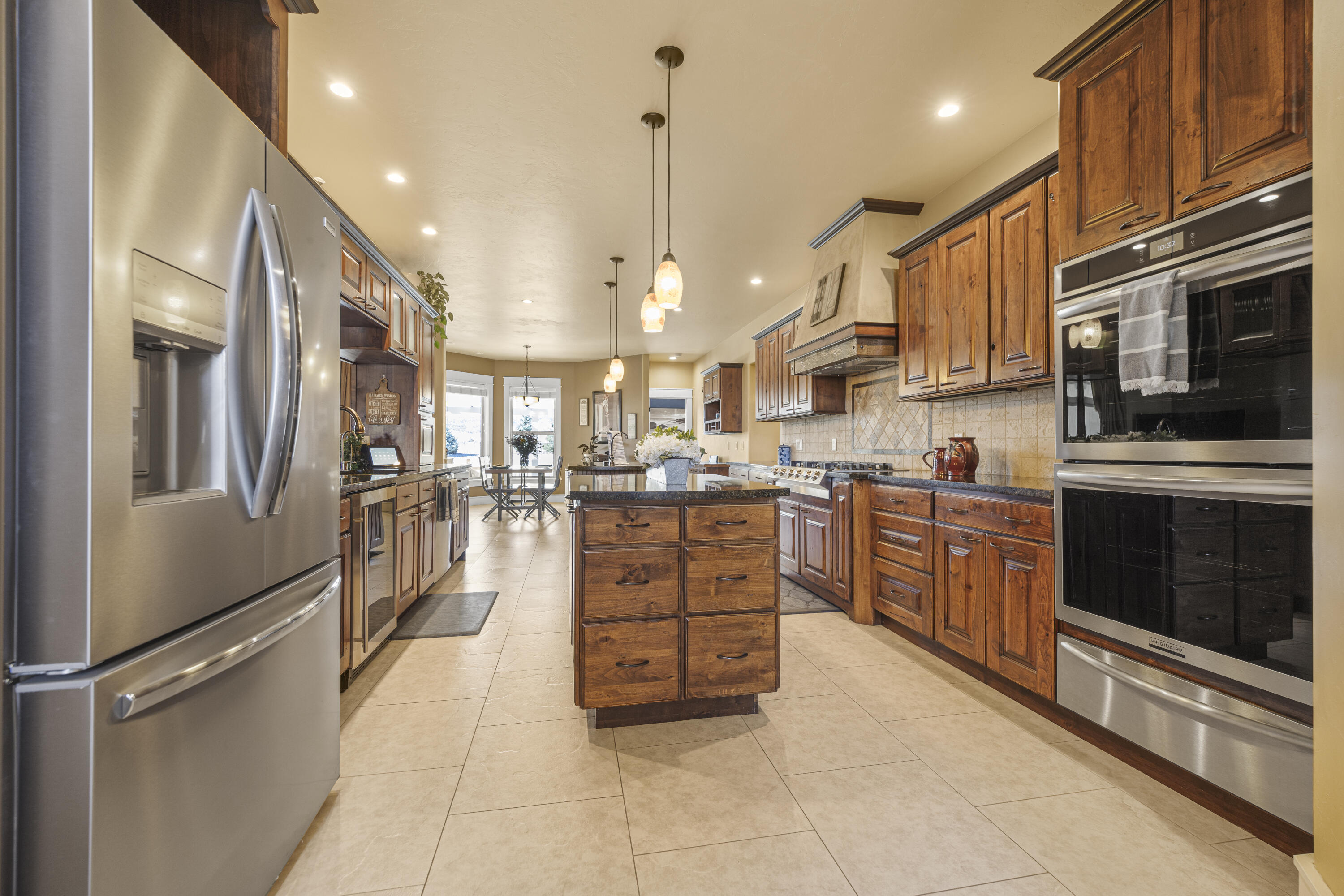 67841 Tumbleweed Road Montrose, CO 81403 - Photo 3 of 21 a kitchen with stainless steel appliances granite countertop a refrigerator a oven and a stove top oven