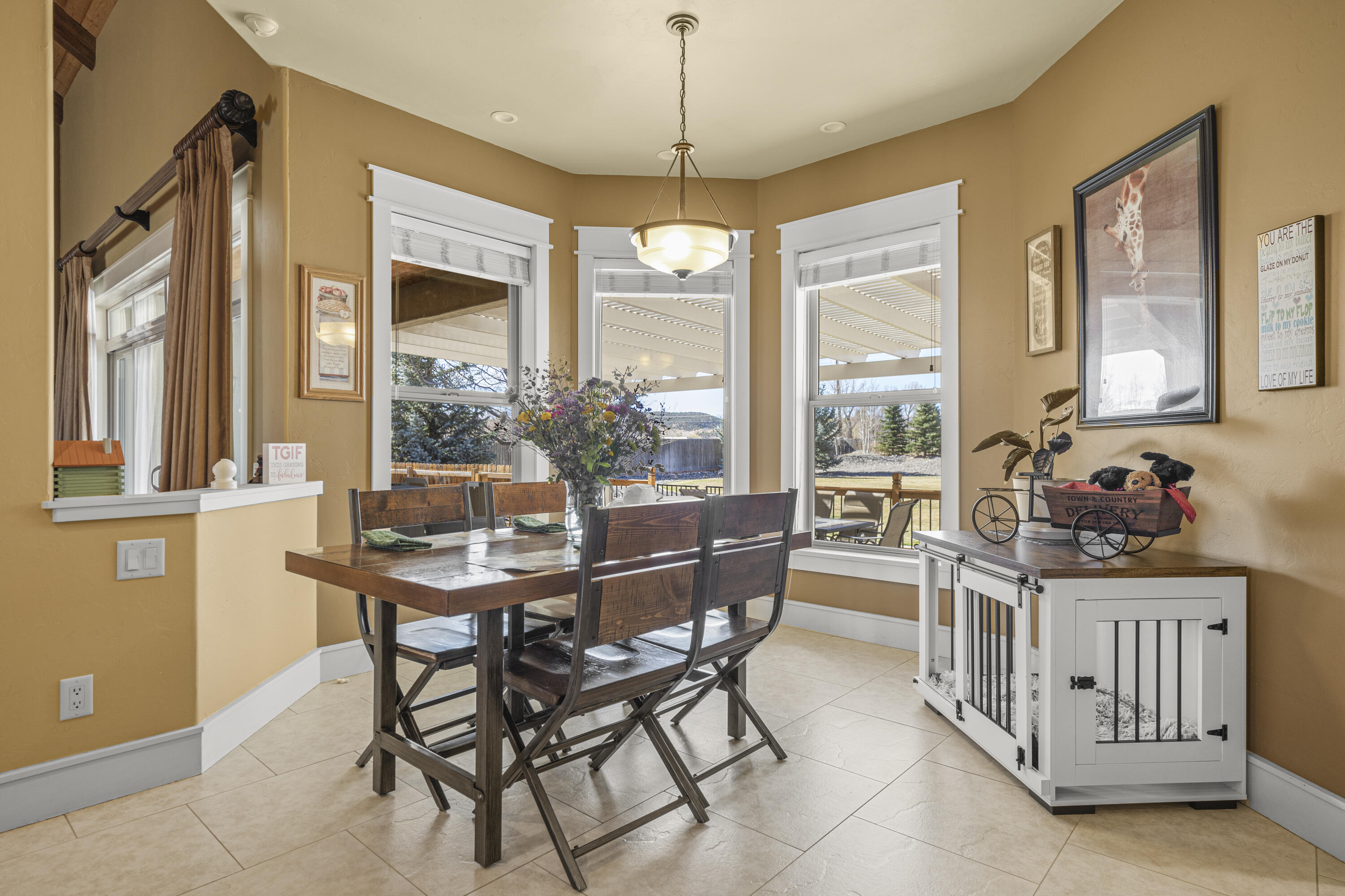 67841 Tumbleweed Road Montrose, CO 81403 - Photo 8 of 21 a view of a dining room with furniture window and outside view