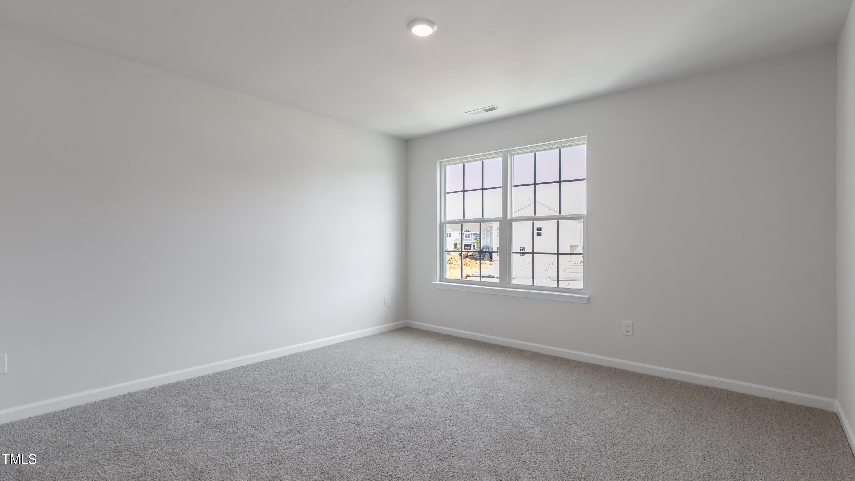 59 Virgo Drive Angier, NC 27501 - Photo 15 of 32 an empty room with a window