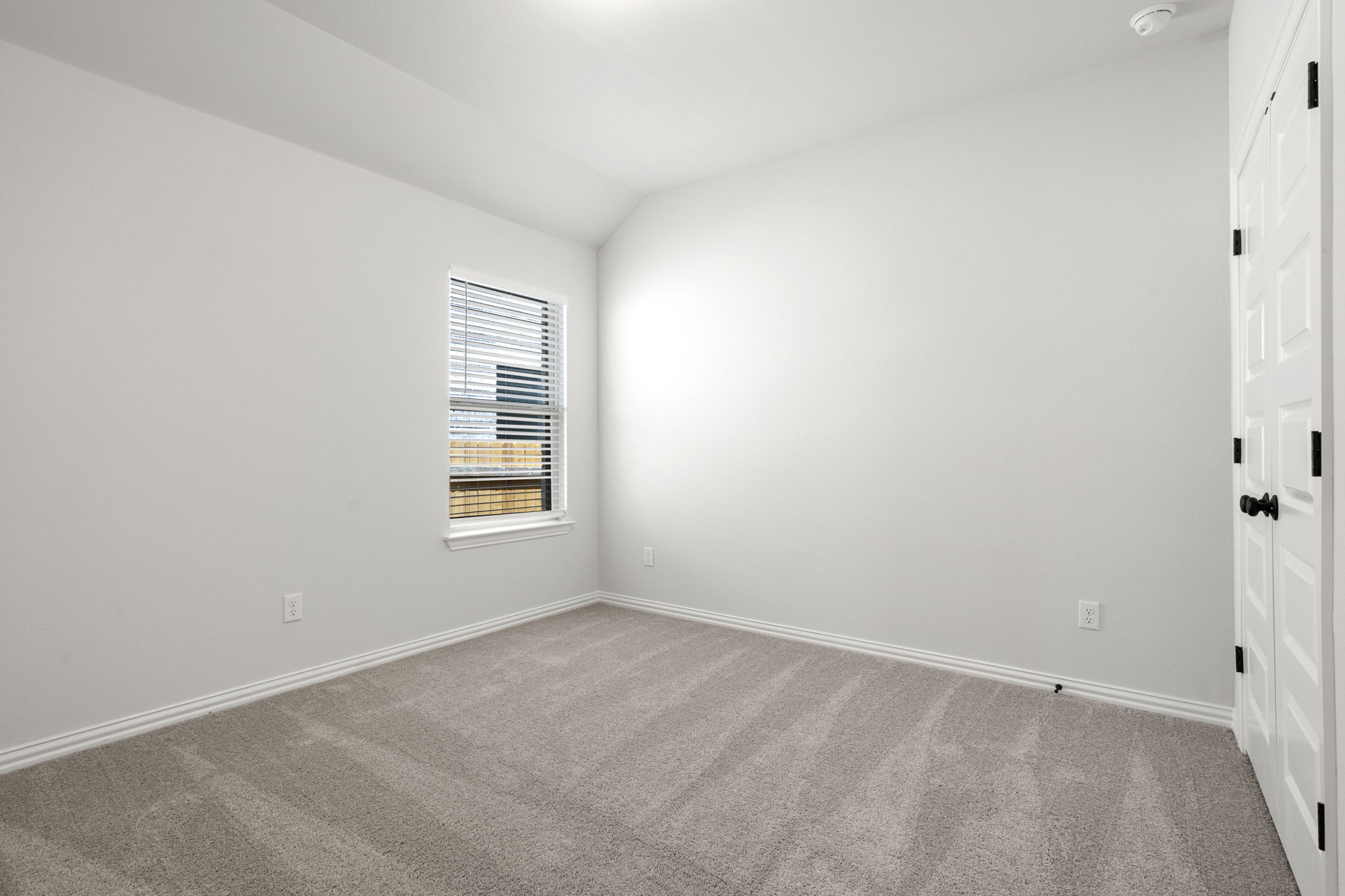341 Fawn Riv Run Kyle, TX 78640 - Photo 19 of 29 a view of an empty room with a window
