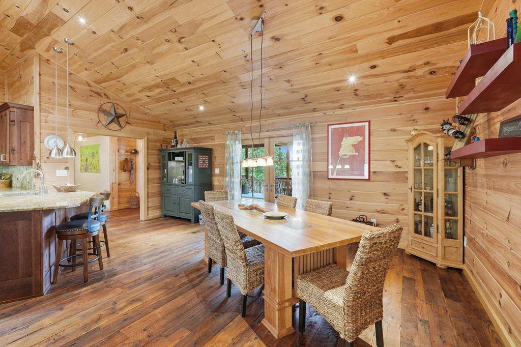 1823 Shoal Creek Road Clarkesville, GA 30523 - Photo 29 of 149 a view of a dining room with furniture window and wooden floor