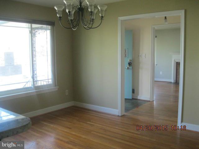 8807 Reading Road Silver Spring, MD 20901 - Photo 6 of 21 a view of a room with wooden floor and windows