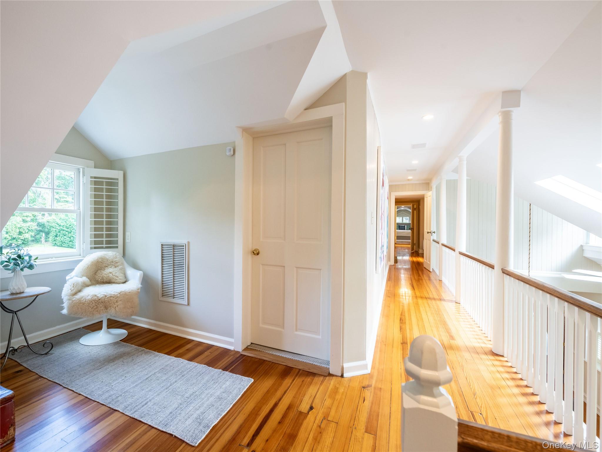 1054 Plandome Road Manhasset, NY 11030 - Photo 16 of 47 a living room with furniture rug and wooden floor