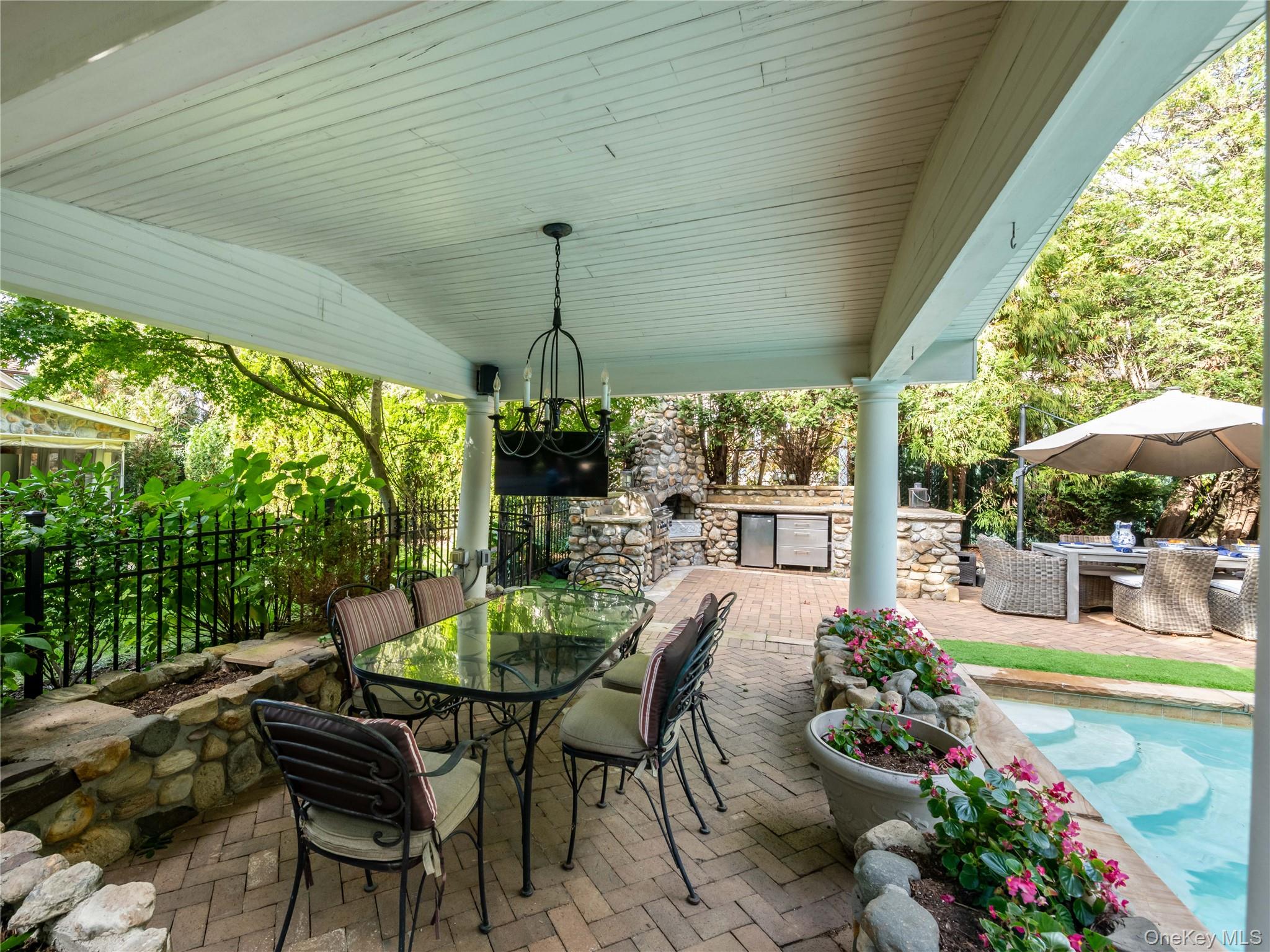 1054 Plandome Road Manhasset, NY 11030 - Photo 24 of 47 a outdoor living space with furniture and garden view