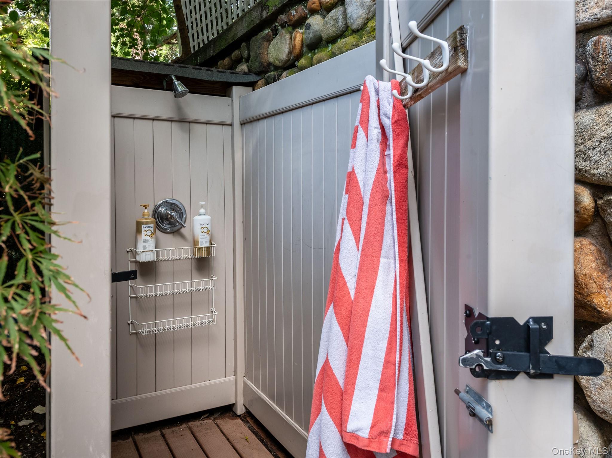 1054 Plandome Road Manhasset, NY 11030 - Photo 27 of 47 a view of walk in closet with clothes and shoes