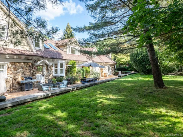 a view of a house with a yard porch and sitting area