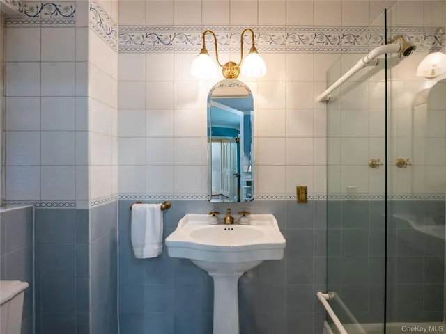 a bathroom with a sink and mirror