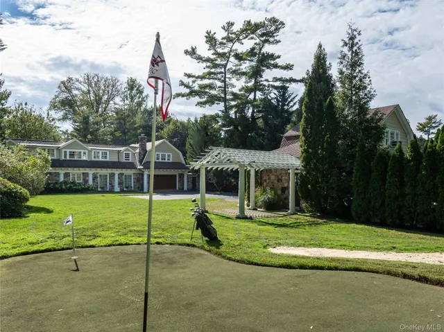 a view of a playground with a house