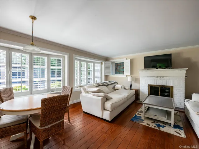 a living room with furniture fireplace and flat screen tv