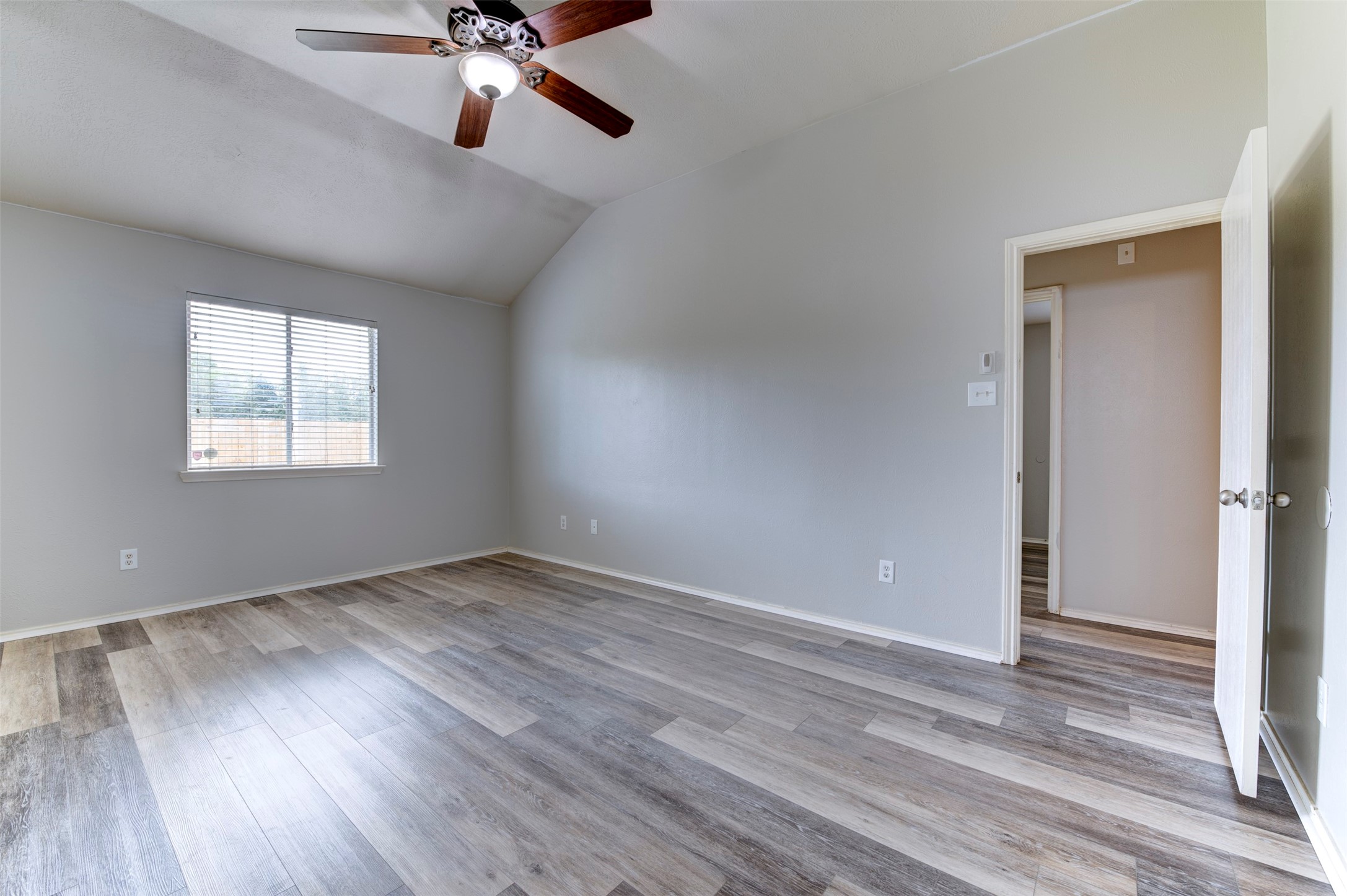 16143 Bantam Ridge Court Houston, TX 77053 - Photo 14 of 18 wooden floor in an empty room with a window