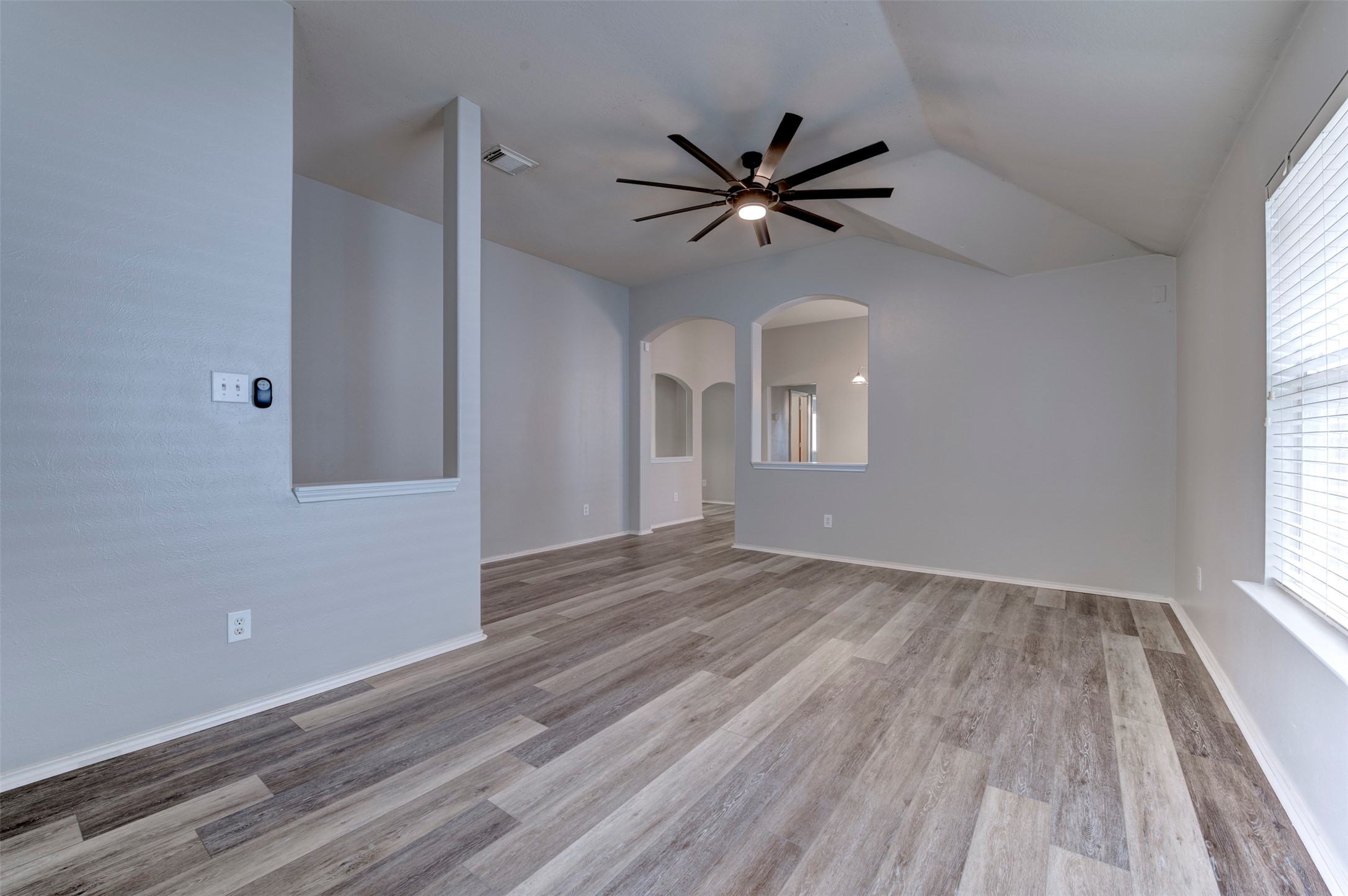 16143 Bantam Ridge Court Houston, TX 77053 - Photo 17 of 18 a view of empty room with wooden floor and fan