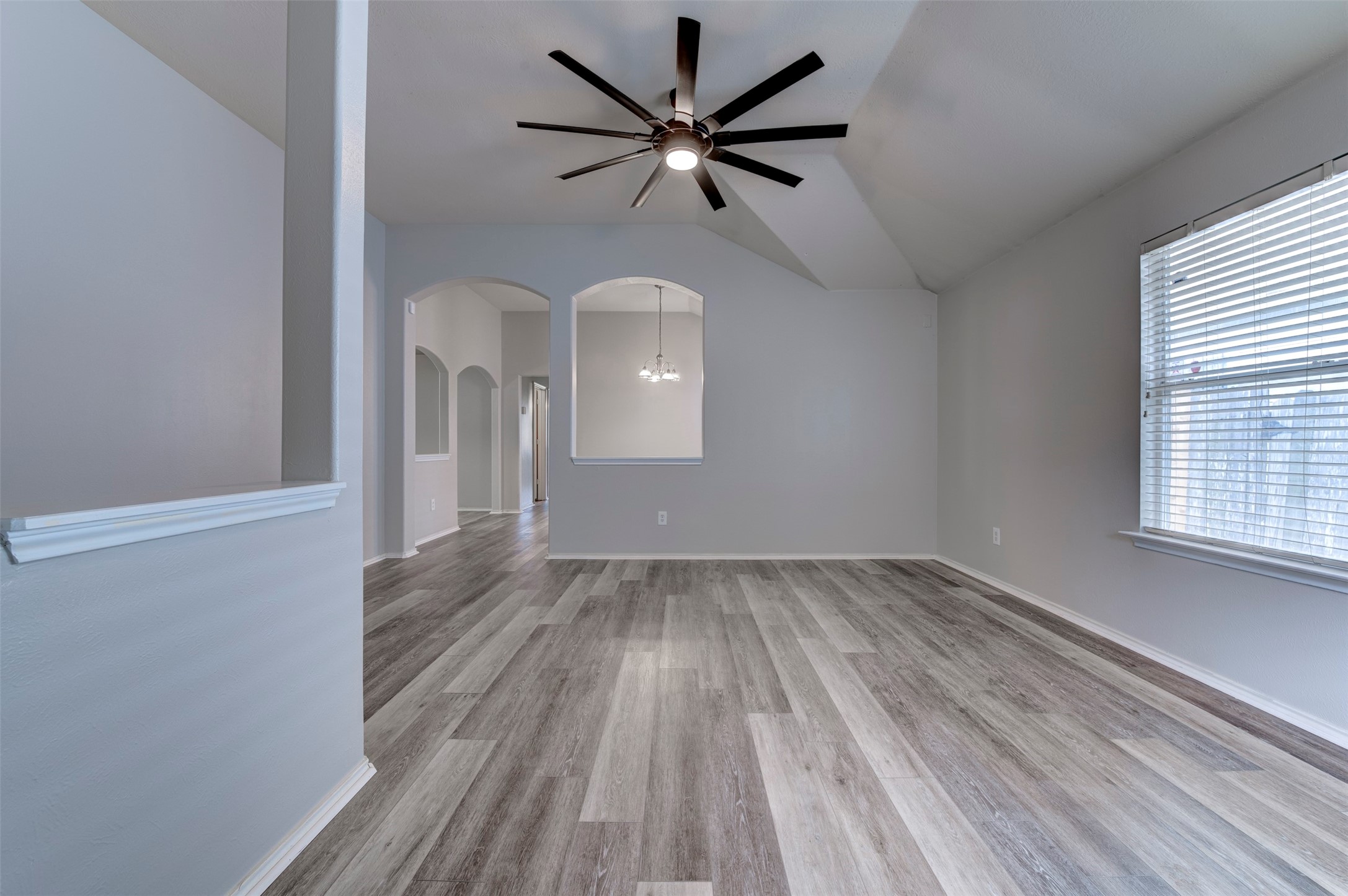 16143 Bantam Ridge Court Houston, TX 77053 - Photo 4 of 18 wooden floor in an empty room with a window