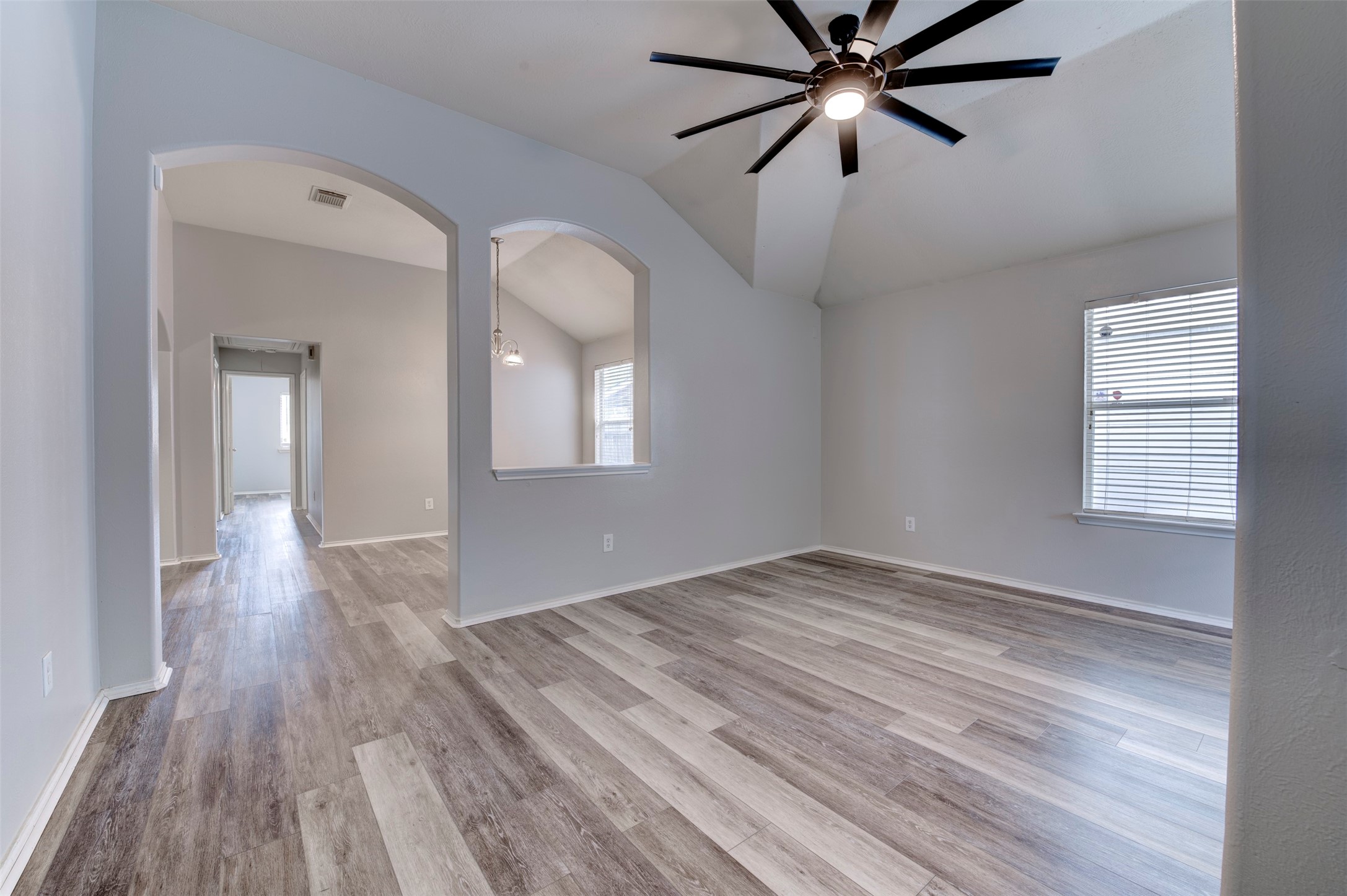 16143 Bantam Ridge Court Houston, TX 77053 - Photo 5 of 18 a view of empty room with wooden floor and fan