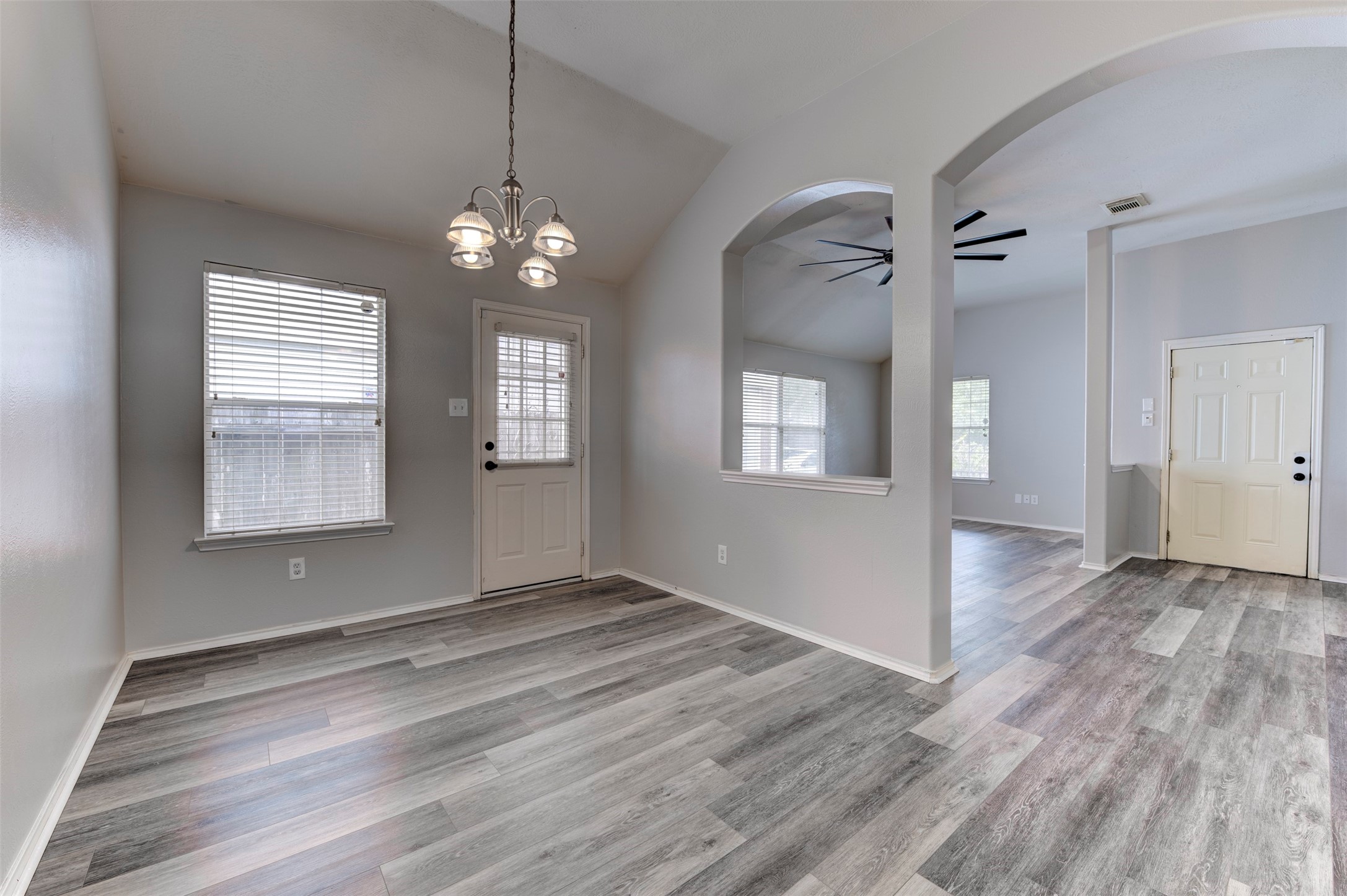 16143 Bantam Ridge Court Houston, TX 77053 - Photo 7 of 18 a view of an empty room with wooden floor and a window