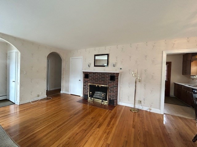 73 Sand Street Gardner, MA 01440 - Photo 11 of 23 a view of a livingroom with wooden floor and a fireplace