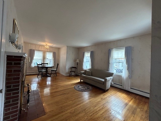 73 Sand Street Gardner, MA 01440 - Photo 12 of 23 a living room with furniture and a fireplace