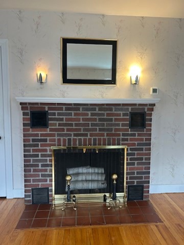 73 Sand Street Gardner, MA 01440 - Photo 15 of 23 a living room with furniture and a fireplace