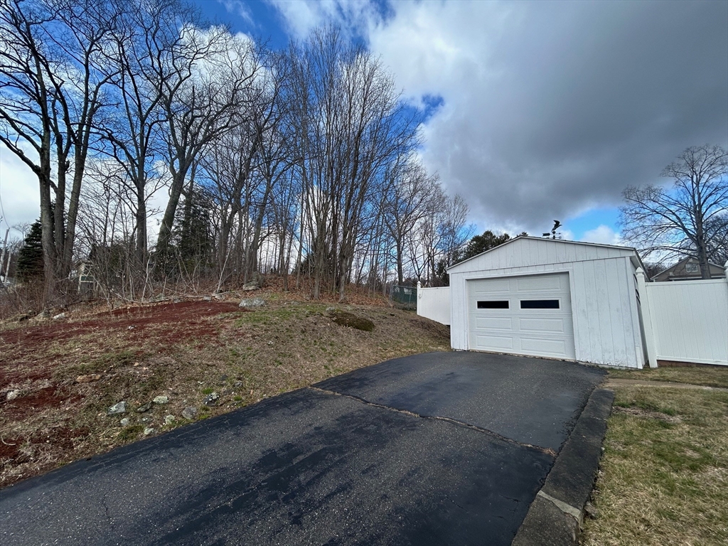 73 Sand Street Gardner, MA 01440 - Photo 3 of 23 a house with trees in front of it