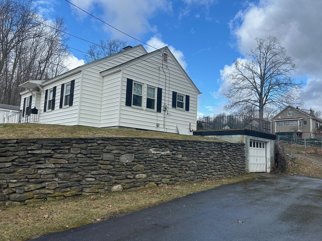 73 Sand Street Gardner, MA 01440 - Photo 4 of 23 a front view of a house with a yard