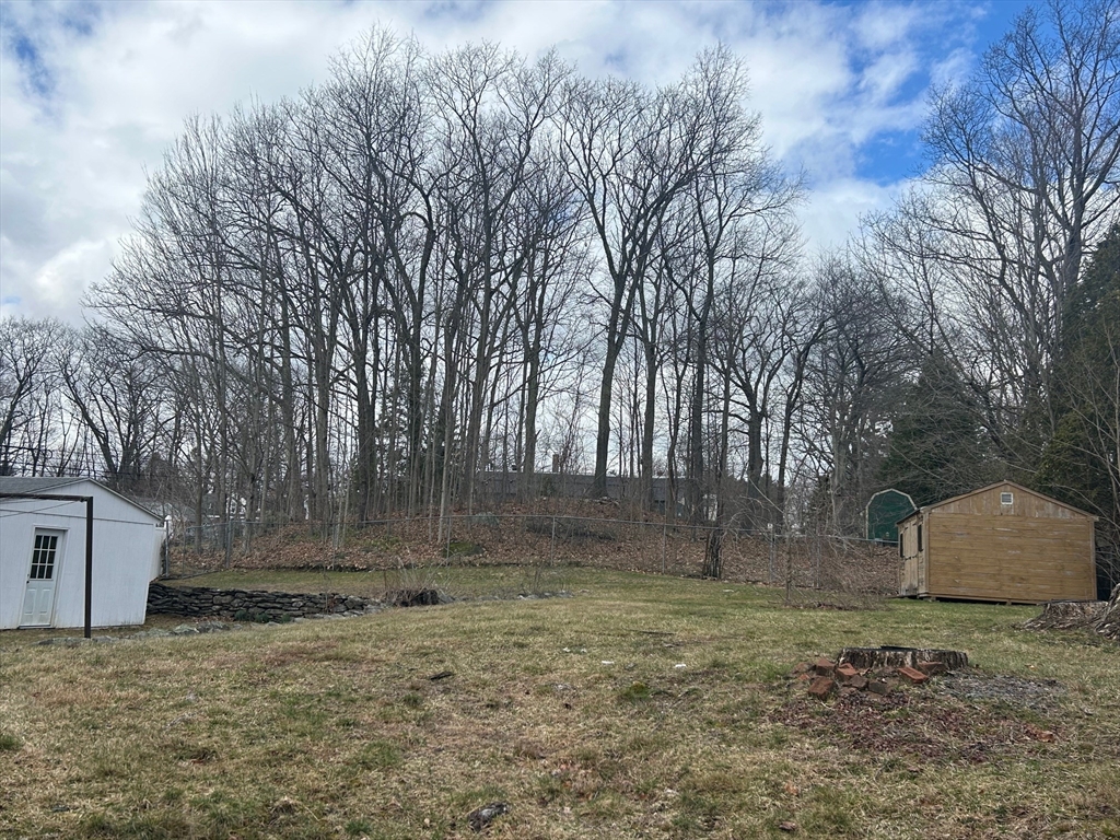 73 Sand Street Gardner, MA 01440 - Photo 5 of 23 a backyard of a house with lots of green space