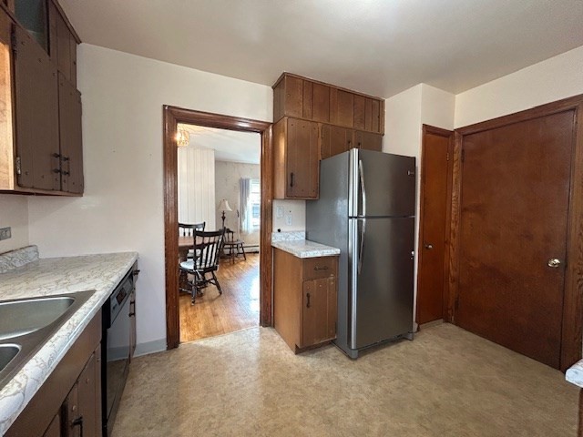 73 Sand Street Gardner, MA 01440 - Photo 8 of 23 a kitchen with refrigerator and cabinets