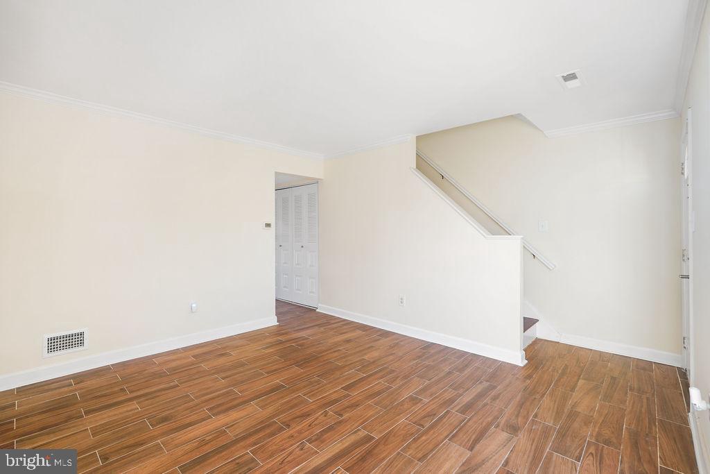 2201 Chamblee Place Herndon, VA 20170 - Photo 14 of 31 an empty room with wooden floor and white walls