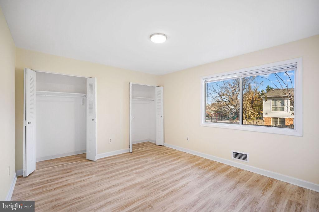2201 Chamblee Place Herndon, VA 20170 - Photo 16 of 31 a view of an empty room with wooden floor and a window