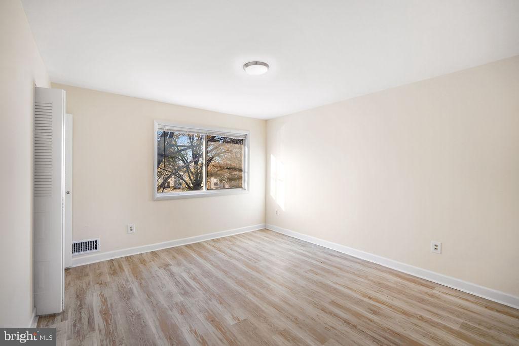 2201 Chamblee Place Herndon, VA 20170 - Photo 18 of 31 an empty room with wooden floor and window