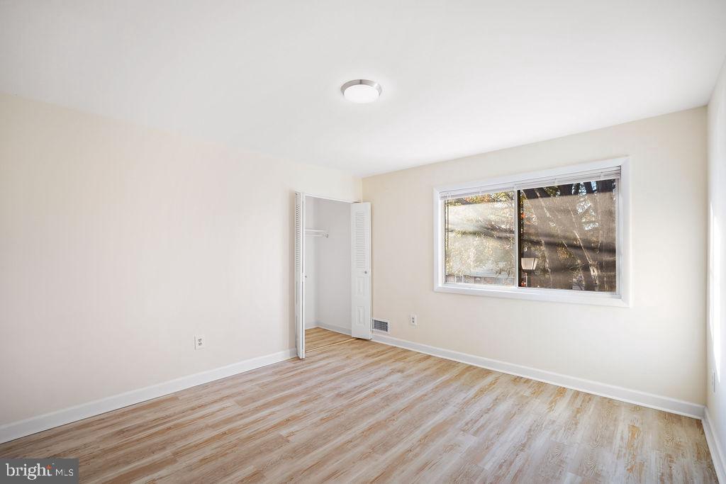 2201 Chamblee Place Herndon, VA 20170 - Photo 19 of 31 an empty room with wooden floor and windows