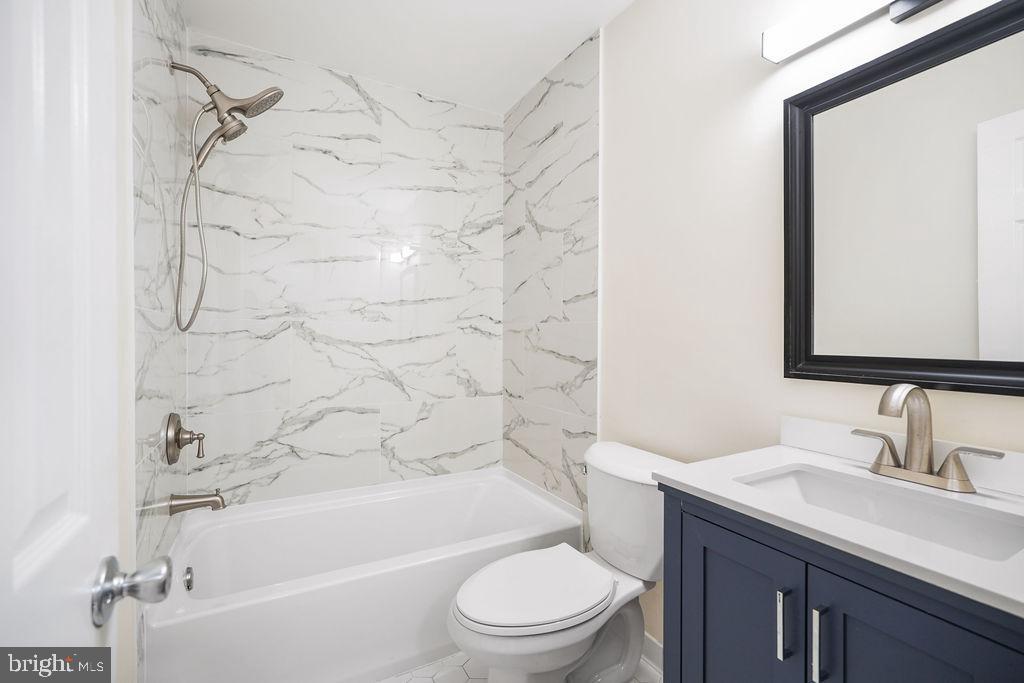 2201 Chamblee Place Herndon, VA 20170 - Photo 20 of 31 a bathroom with a sink a toilet and shower