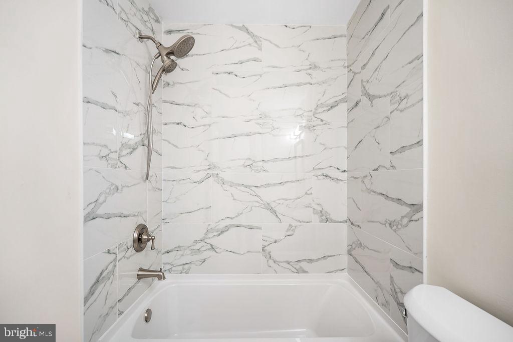 2201 Chamblee Place Herndon, VA 20170 - Photo 21 of 31 a bathroom with a bathtub and shower